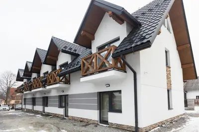 a rendering of a building with black roof at Apartamenty,pokoje Paholski in Zubrzyca Górna