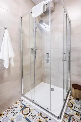 a shower with a glass door in a bathroom at Apartamenty,pokoje Paholski in Zubrzyca Górna