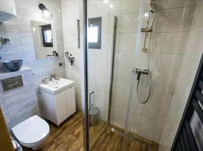 a bathroom with a shower and a toilet and a sink at Domki Całoroczne Danielowa Ostoja-Zator,Palczowice in Zator