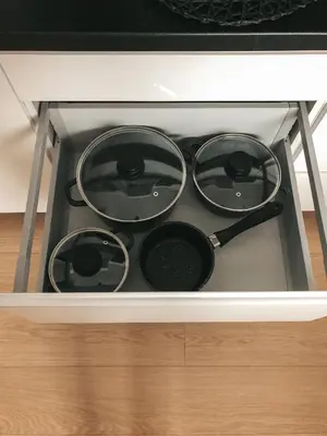 four pots and pans sitting on top of a stove at Jaszczurowa Apartament II in Jaszczurowa