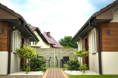 a row of houses with a pathway between them at Calm Village in Zator