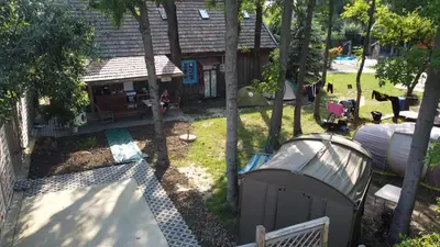 an overhead view of a backyard with a house and a tent at Kawalerski, Impreza, Wesele in Miechowice Wielkie
