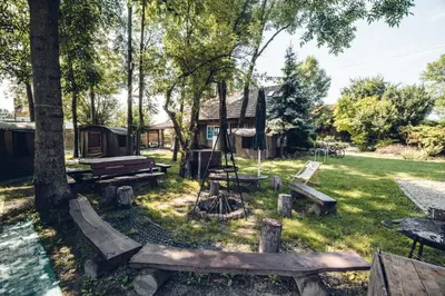 a park with picnic tables and a cabin at Kawalerski, Impreza, Wesele in Miechowice Wielkie