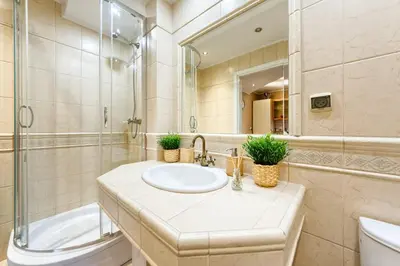 a bathroom with a sink and a shower at Apartament Kapelanka CoWork in Kraków
