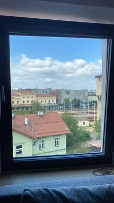 a window with a view of a building at Uroczy apartament w centrum Krakowa in Kraków
