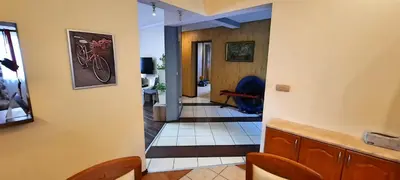 a hallway of a house with a bike on the wall at Chata u Górala in Stróża