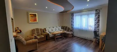 a living room with a couch and a table at Chata u Górala in Stróża