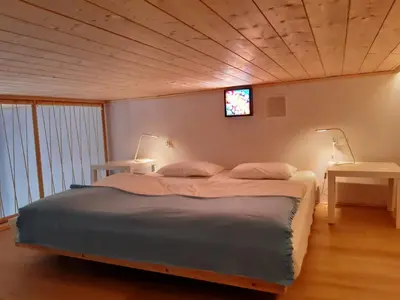 a bedroom with a bed and a tv on the wall at Silent Place in Heart of Krakow near Main Station in Kraków