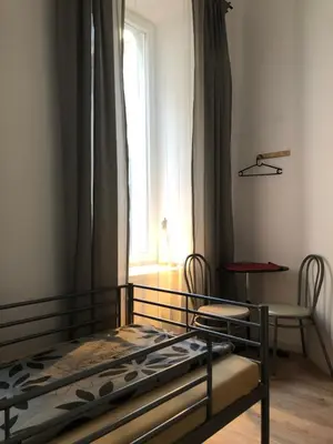 a bedroom with two bunk beds and a window at Caramba in Kraków