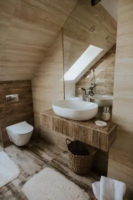 a bathroom with a sink and a toilet and a mirror at Wzgórze Marzeń in Zembrzyce