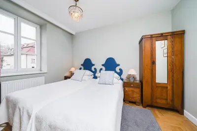 a bedroom with a white bed and a window at In The Heart Of Jewish Quarter - Old Synagogue - by Upstairs in Kraków