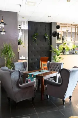 a dining room with a table and chairs at NATA Pokoje Gościnne Restauracja in Libiąż