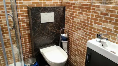 a bathroom with a toilet and a sink at NATA Pokoje Gościnne Restauracja in Libiąż