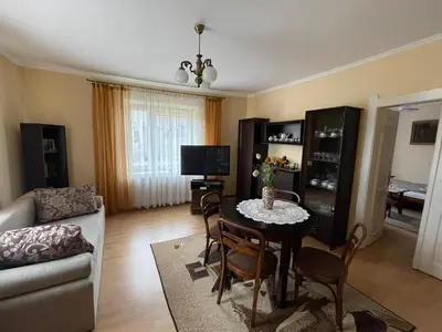 a living room with a table and a couch at Apartament in Bochnia