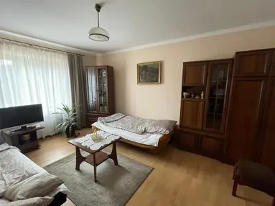a living room with a couch and a table at Apartament in Bochnia