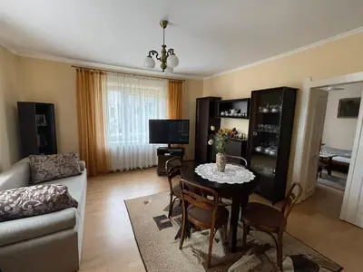 a living room with a table and a couch at Apartament in Bochnia