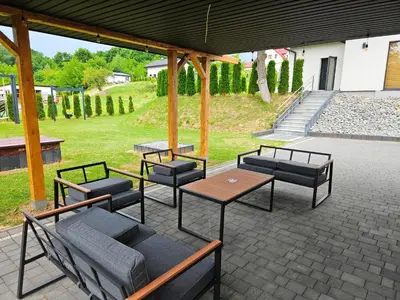 a bathroom with a shower and a toilet and a sink at Domek z jacuzzi Cztery Pory Roku in Czchów