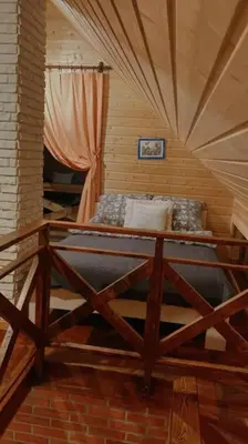 a bedroom with a bed in a room with a window at Domki na Górniej Łące - Domek Górny in Łazany