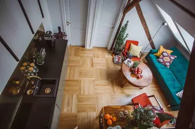 an overhead view of a living room with a blue couch at HAPPY MOMENTS APARTMENTS in Kraków
