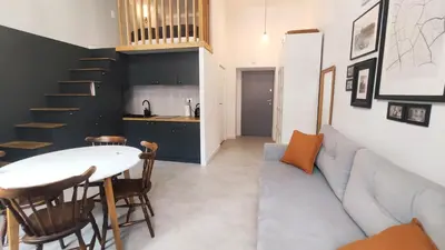 a living room with a couch and a table at Starowislna 43 by Homeprime in Kraków