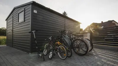 a group of bikes parked next to a garage at Słoneczne Zacisze Las obok Zatora in Las