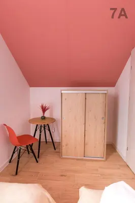 a room with a bed and a table and a cupboard at Słoneczne Zacisze Las obok Zatora in Las