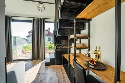 a dining room with a table and a window at Gościniec Na Rozdrożu in Libiąż
