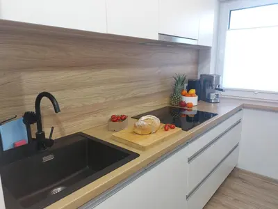 a kitchen with a sink and a counter top at MR HOME APARTMENTS - Limba in Kraków