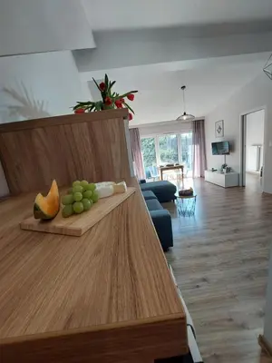 a living room with a table with fruit on it at MR HOME APARTMENTS - Limba in Kraków