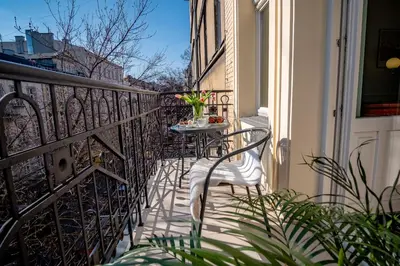a balcony with a table and chairs on it at Luxury Apartment St. Sebastian in Kraków