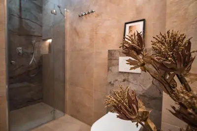 a bathroom with a shower and a toilet and a shower at Luxury Apartment St. Sebastian in Kraków