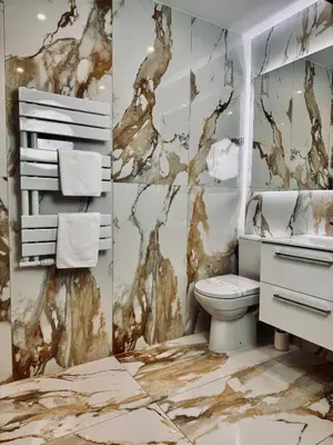 a bathroom with a sink and a toilet at Apartamenty Modrzewiowa Zator in Piotrowice