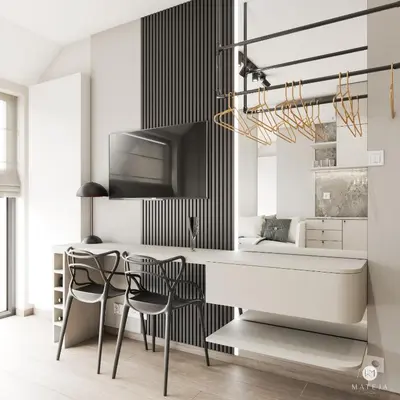 a kitchen with a table and chairs in a room at Iron Apartments by MB Apartments in Kraków