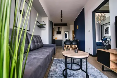 a living room with a couch and a table at Apartament Timi Zator by Housine in Zator