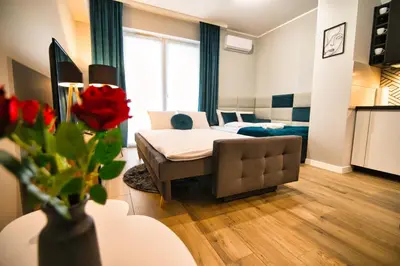 a living room with a bed and a couch at Apartament Emi Zator by Housine in Zator