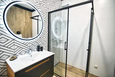 a bathroom with a sink and a mirror at Apartament Emi Zator by Housine in Zator