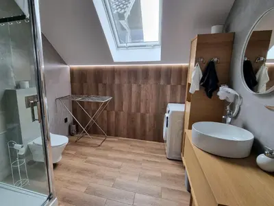 a bathroom with a sink and a toilet and a shower at Apartamenty ASLux - Noclegi Energylandia Zator in Zator