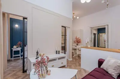 a living room with a couch and a table at Olver Apartment in Kraków