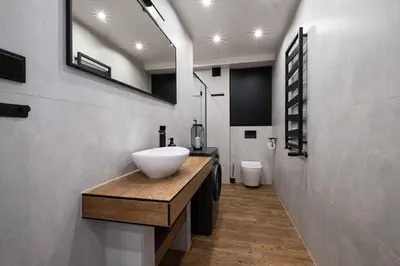 a bathroom with a white sink and a mirror at Katowicka Premium Apartment in Kraków