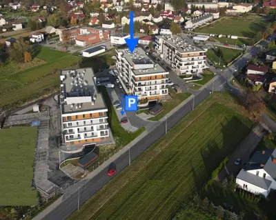 an aerial view of a building with a blue arrow pointing to a building at Apartament Marko in Zator