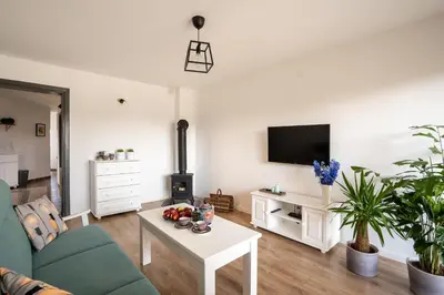 a living room with a couch and a table at Apartament Nad Różami in Oświęcim