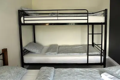 a couple of bunk beds in a room at Ach To Tu! Apartament Zator in Zator