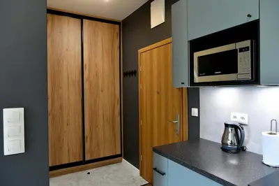 a kitchen with a counter top and a microwave at Ach To Tu! Apartament Zator in Zator
