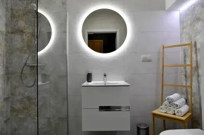 a bathroom with a sink and a mirror at Ach To Tu! Apartament Zator in Zator