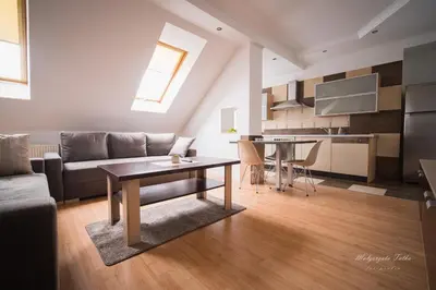 a living room with a couch and a table at Apartament Best Rest in Wadowice