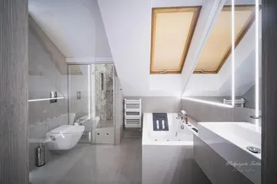 a bathroom with a sink and a toilet at Apartament Best Rest in Wadowice