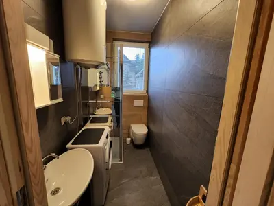 a small bathroom with two sinks and a toilet at Agro-Gala in Rabka