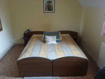 a bed in a corner of a room at Agro-Gala in Rabka