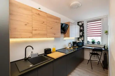 a kitchen with a sink and a counter top at Staymoovers - Ladne mieszkanie w poblizu Energylandii - Parking in Zator