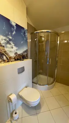 a bathroom with a toilet and a sink at Apartamenty Centrum in Olkusz